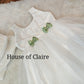 White baptism dress with cute green bow on front for girls - elegant christening attire for baby girl baptism dress in Bangalore India