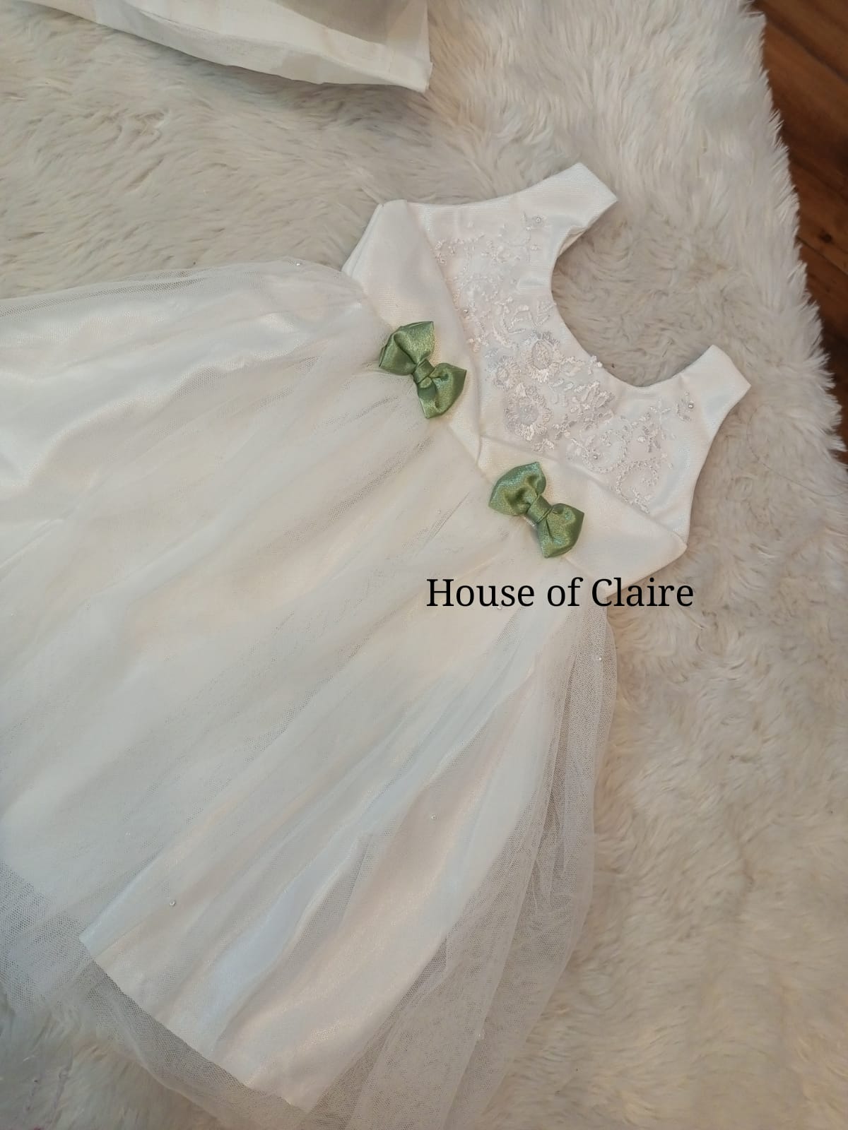 White baptism dress with cute green bow on front for girls - elegant christening attire for baby girl baptism dress in Bangalore India