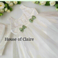 White baptism dress with cute green bow on front for girls - elegant christening attire for baby girl baptism dress in Bangalore India