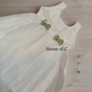 White baptism dress with cute green bow on front for girls - elegant christening attire for baby girl baptism dress in Bangalore India